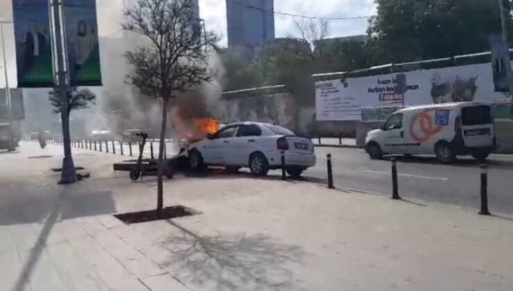 Mecidiyeköy’de benzin deposu sızan otomobilin el frenini çekmeyi unuttu, tabeleya çarpan araç alev alev yandı